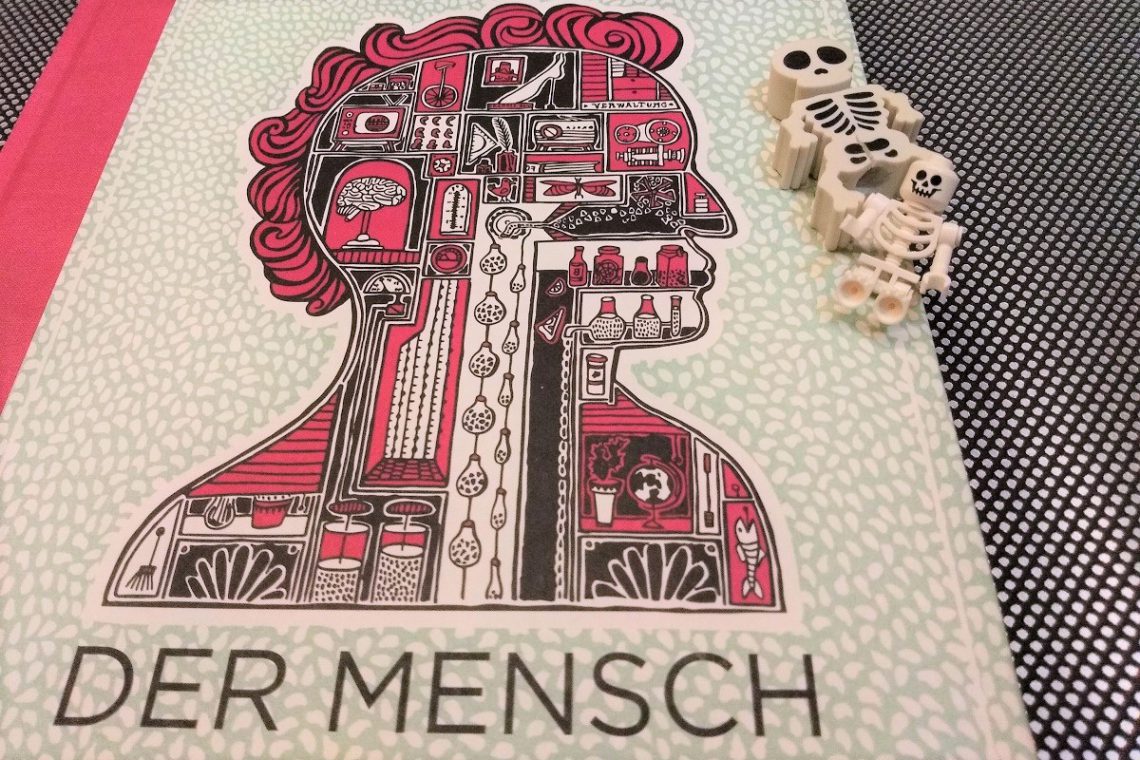 Cover auf dem ein menschlicher Kopf im Querschnitt als Illustration zu sehen ist, darauf zwei kleine Spielzeugskelette