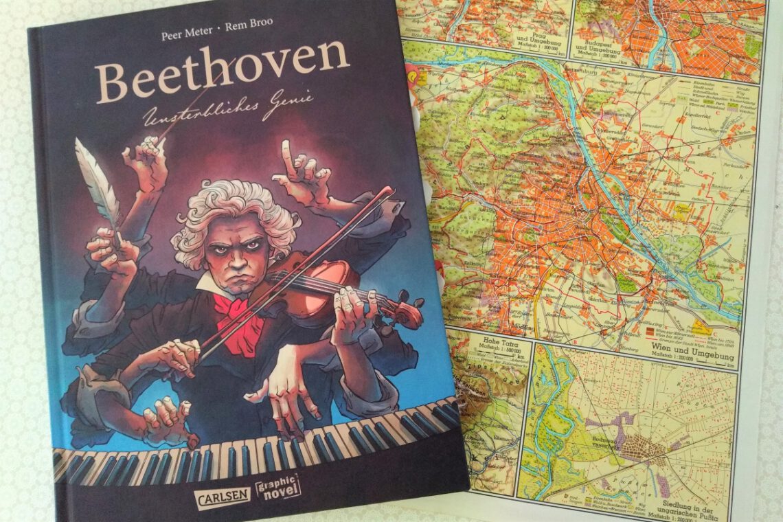 Comic auf dem Beethoven klavierspielend abgebildet ist, daneben eine ältere Straßenkarte von Wien