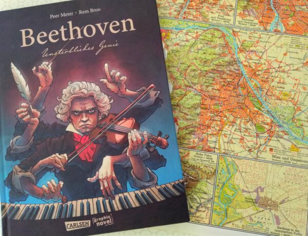 Comic auf dem Beethoven klavierspielend abgebildet ist, daneben eine ältere Straßenkarte von Wien