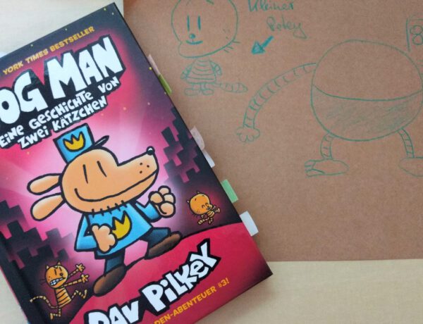 Comic zeigt den Polizisten mit Hundekopf, daneben eine Zeichnung auf braunem Papier