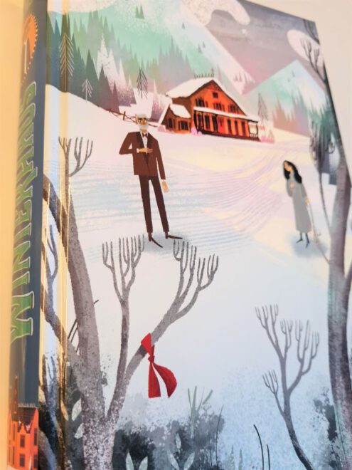 Buch ohne Schutzumschlag zeigt eine Schneelandschaft mit zwei Menschen und eine Hütte